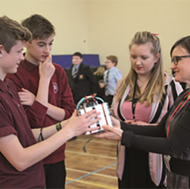 Students discuss their ‘bots’ with science teacher Charlotte Gardener (2nd right) and Sonja Chirico Indrebø