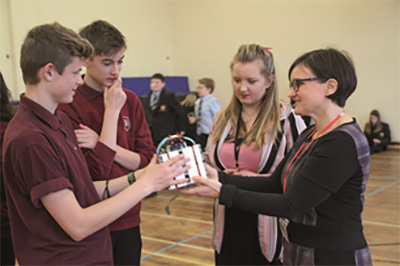 Students discuss their 'bots' with science teacher Charlotte Gardener (2nd right) and Sonja Chirico Indrebø