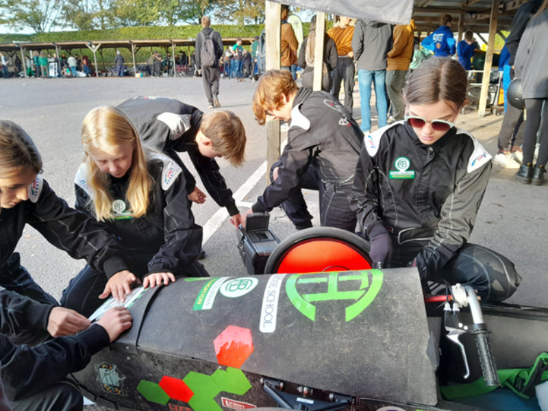 Students from the UK and overseas fill the historic garages at Goodwood.