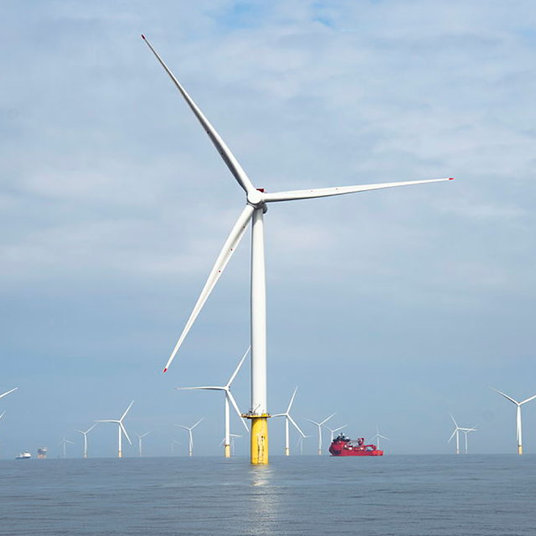 WInd turbines and supply boat.