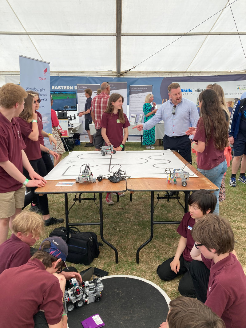 Ross McMillan with members of the Sheringham High School Robotics Club