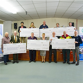 Six local charities in Necton Village Hall receive a share of the £9000 Dudgeon Charity Awards