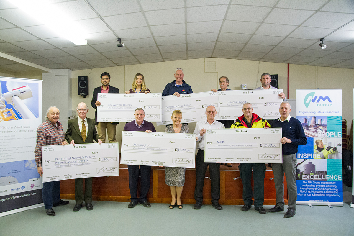 Six local charities in Necton Village Hall receive a share of the £9000 Dudgeon Charity Awards